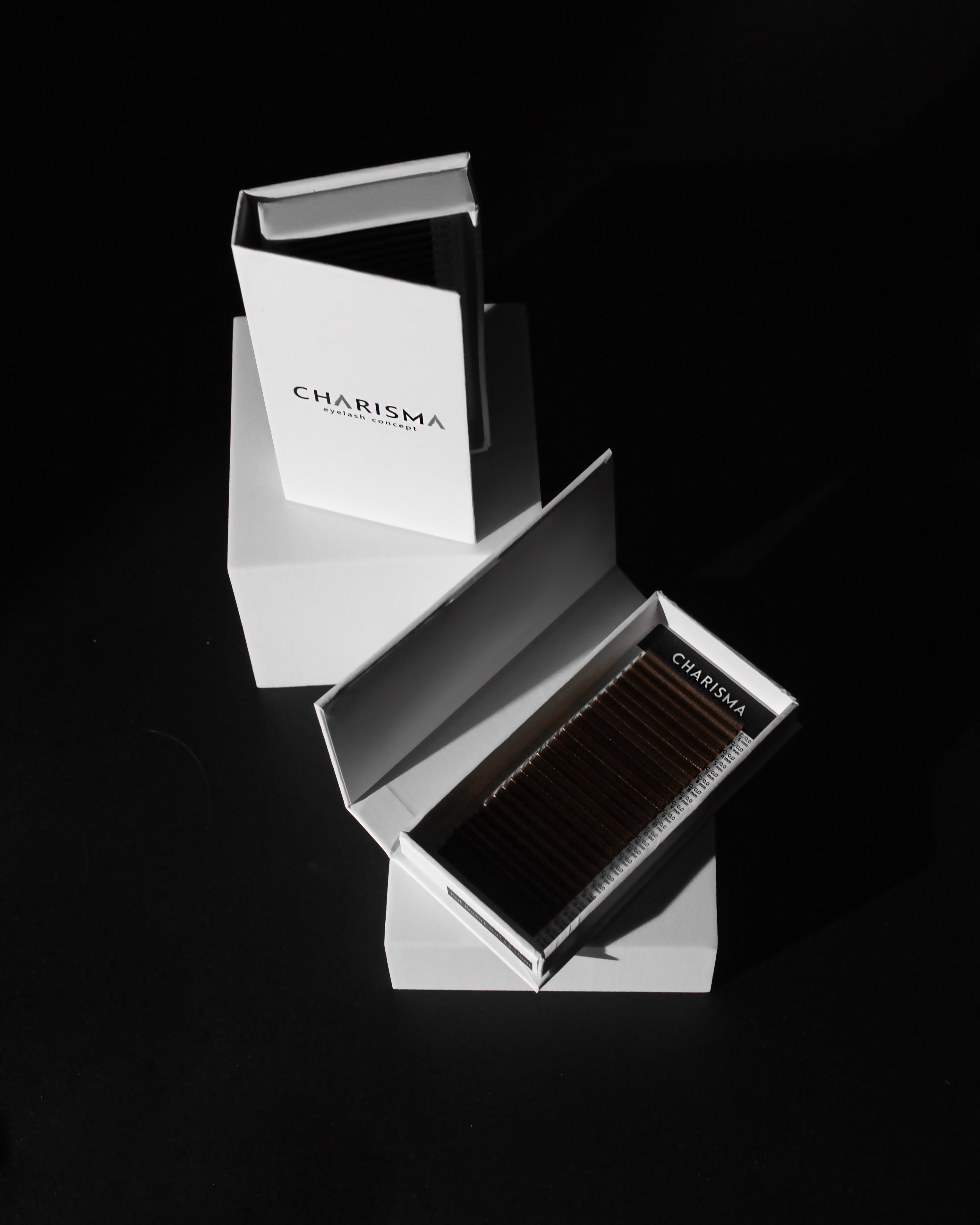 Dark chocolate lash extensions on a professional lash tray