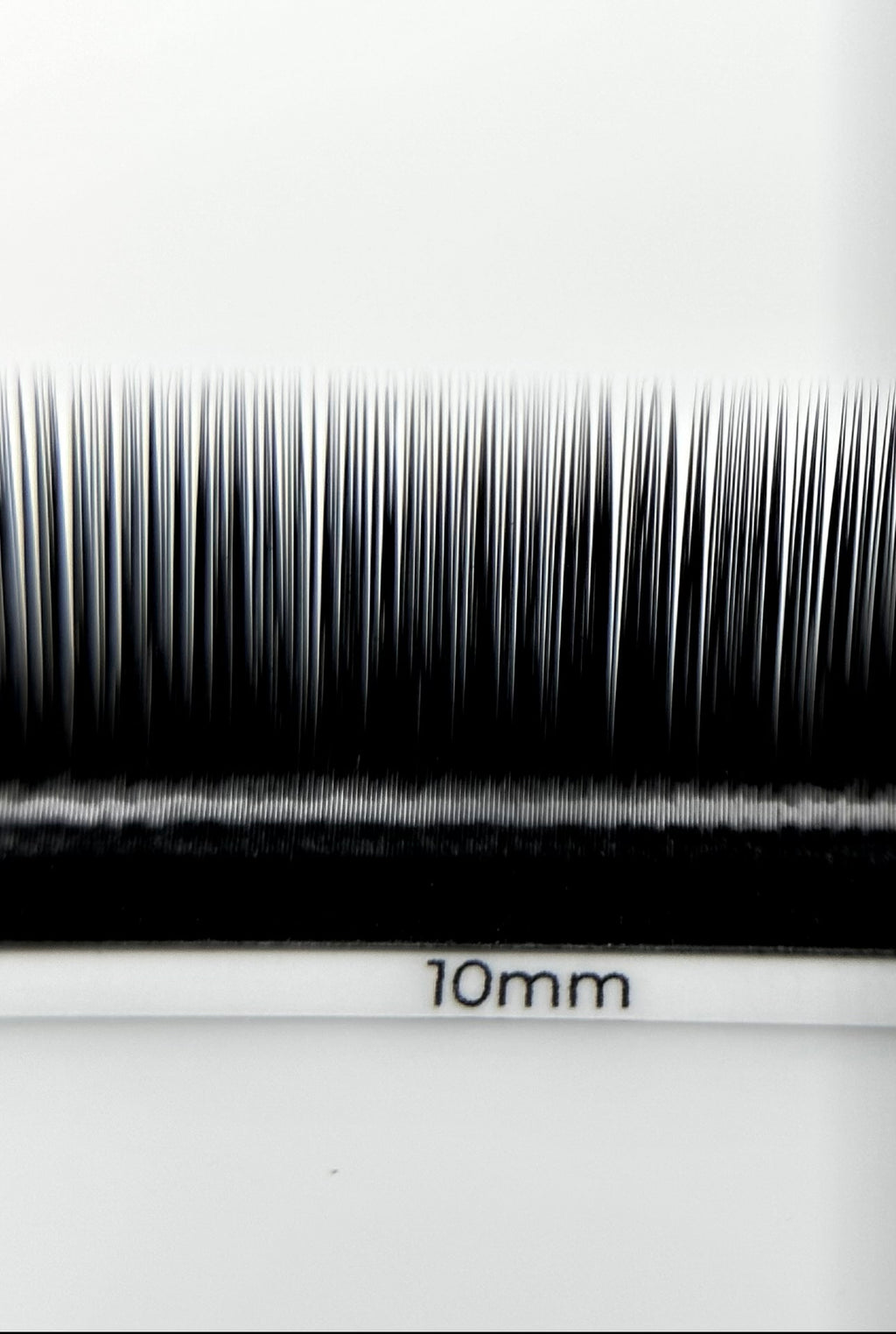ESSENTIALS lash strips on yellow 2 mm adhesive tape